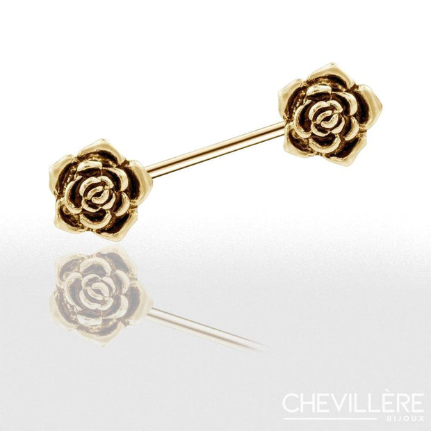 Piercing téton doré rosé avec barre droite et roses aux extrémités