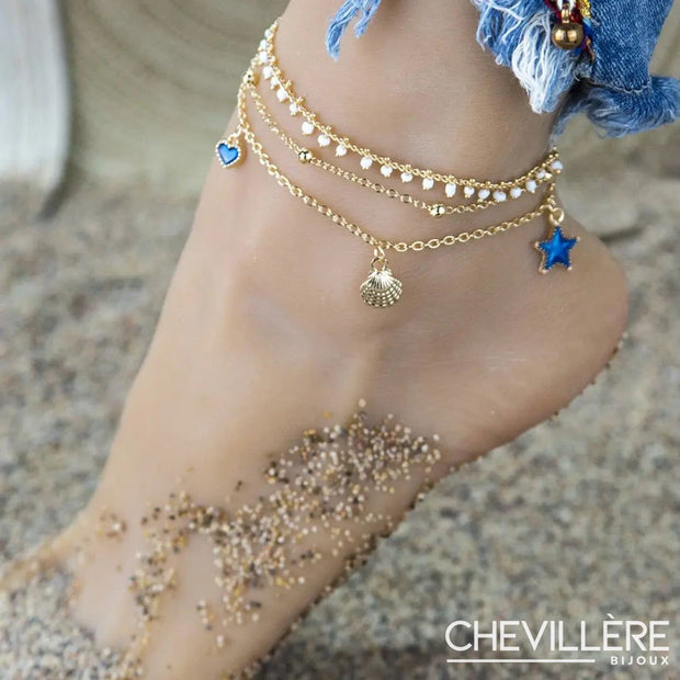 Bracelet cheville coquillage doré avec perles et chaînes fines