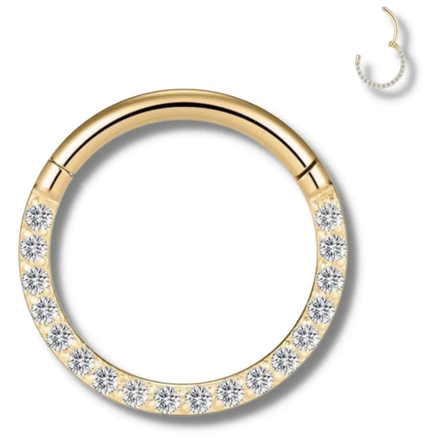 Piercing clitoris en anneau doré avec zircons sertis